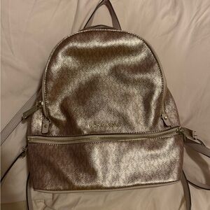 Gently used Michael Kors rose gold backpack